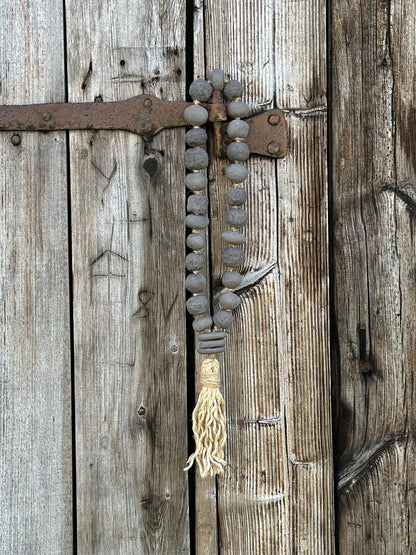 Studio Meraki Decorative ceramic bead garland with black beads and hemp tassle